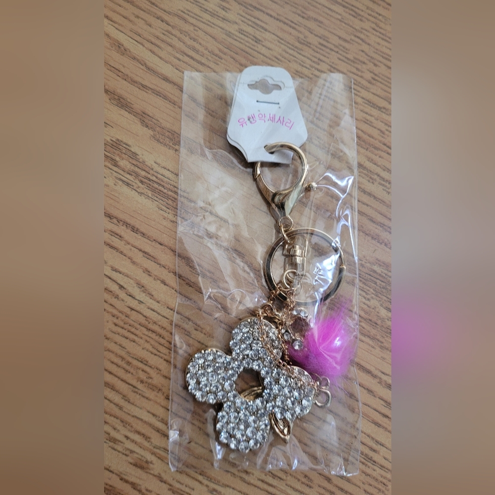 Cute studded purse bling Keychain with gold colour hardware floral pom pom